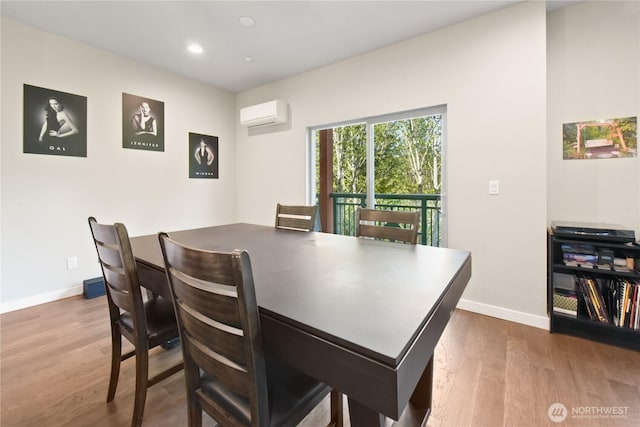 1086 Collier Pl SW, Issaquah, WA 98027 - dining room with a wall unit AC, baseboards, dark wood-style flooring, and recessed lighting