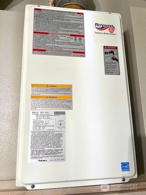 96 Kooskooskie Rd, Walla Walla, WA 99362 - detailed view of tankless water heater and a textured wall
