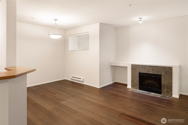 21450 40th Pl S Unit A, Seatac, WA 98198 - unfurnished living room with a baseboard radiator, dark wood finished floors, baseboards, and a fireplace