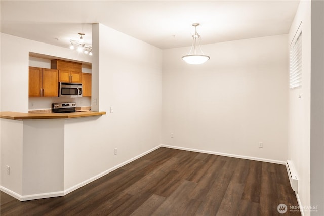 21450 40th Pl S Unit A, Seatac, WA 98198 - unfurnished dining area with dark wood-style floors, baseboard heating, and baseboards