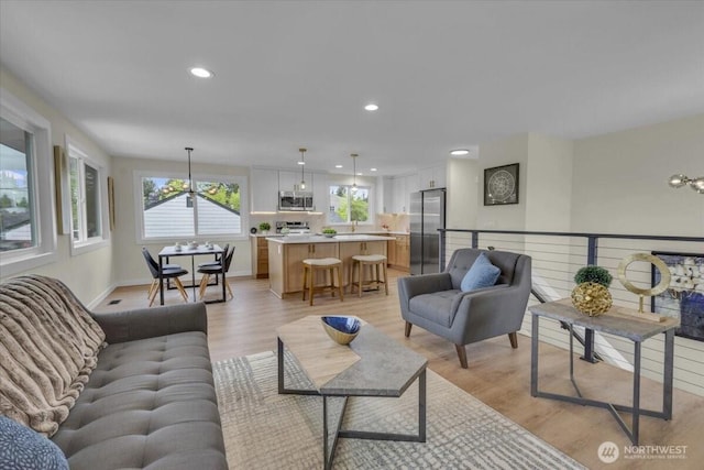 1246 SW 148th St, Burien, WA 98166 - living room with light wood-style flooring, recessed lighting, baseboards, and a chandelier