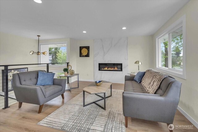 1246 SW 148th St, Burien, WA 98166 - living area with plenty of natural light, a fireplace, recessed lighting, wood finished floors, and a chandelier