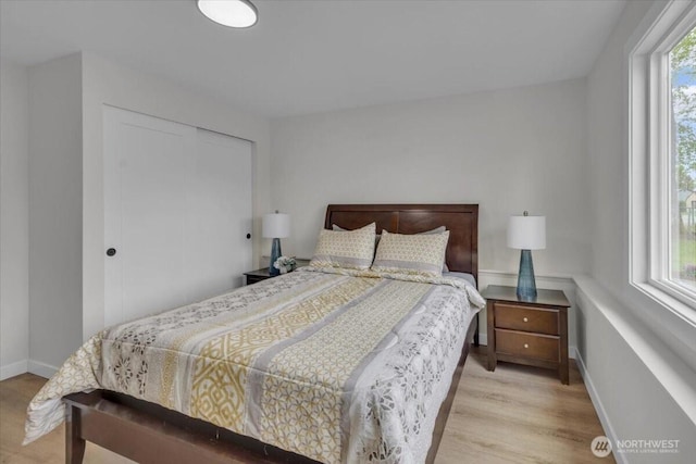 1246 SW 148th St, Burien, WA 98166 - bedroom with wood finished floors, a closet, and baseboards