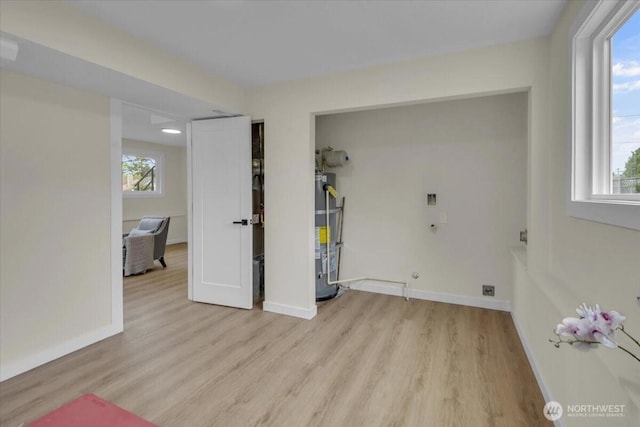 1246 SW 148th St, Burien, WA 98166 - interior space featuring secured water heater, plenty of natural light, and wood finished floors