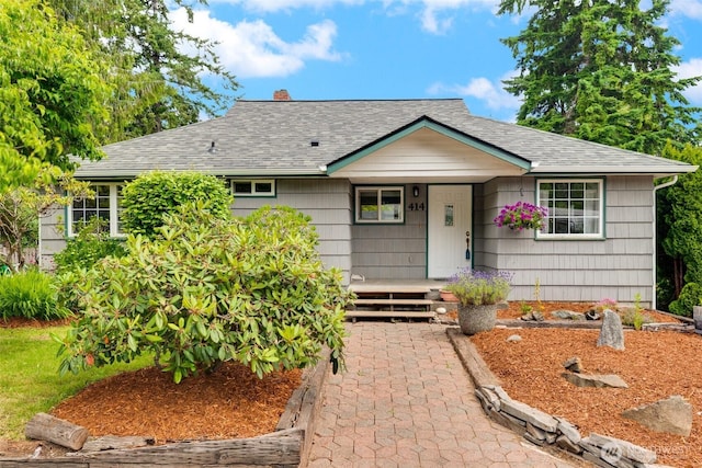 414 W Wyandotte Ave, Shelton, WA 98584 - single story home featuring a shingled roof, a chimney, and covered porch