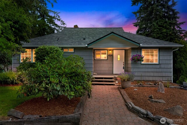 414 W Wyandotte Ave, Shelton, WA 98584 - view of front of property featuring a shingled roof, a chimney, and covered porch