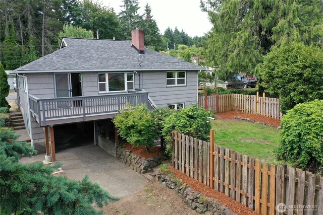 414 W Wyandotte Ave, Shelton, WA 98584 - view of front facade featuring a shingled roof, a chimney, and a wooden deck