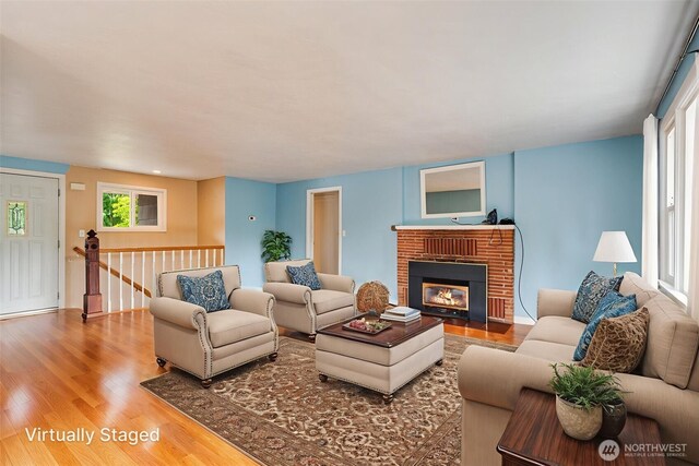 414 W Wyandotte Ave, Shelton, WA 98584 - living room with wood finished floors, plenty of natural light, and a fireplace