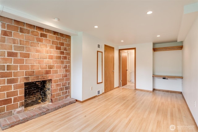 414 W Wyandotte Ave, Shelton, WA 98584 - unfurnished living room with light wood finished floors, recessed lighting, and a brick fireplace