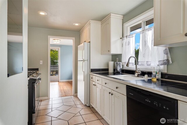 414 W Wyandotte Ave, Shelton, WA 98584 - kitchen with dishwasher, stainless steel gas range, freestanding refrigerator, recessed lighting, and light tile patterned floors
