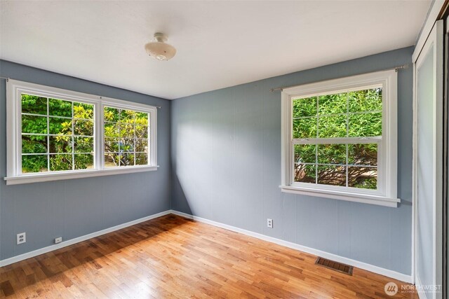 414 W Wyandotte Ave, Shelton, WA 98584 - unfurnished room featuring healthy amount of natural light and wood finished floors