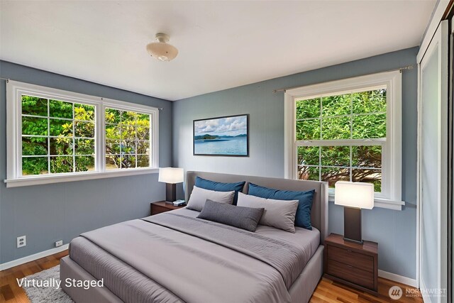 414 W Wyandotte Ave, Shelton, WA 98584 - bedroom with multiple windows and wood finished floors