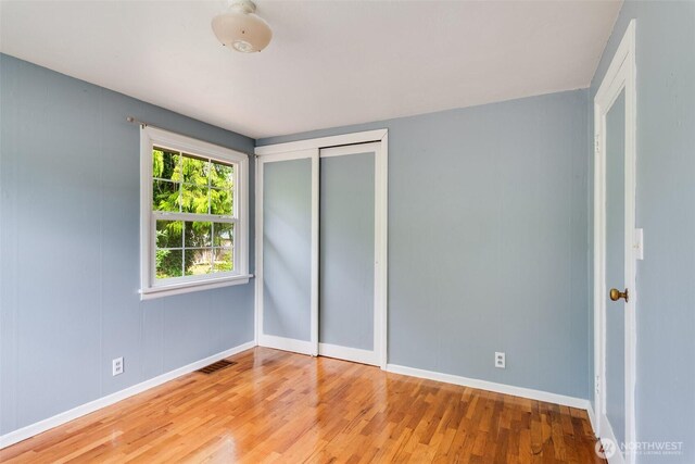 414 W Wyandotte Ave, Shelton, WA 98584 - unfurnished bedroom with wood finished floors and a closet