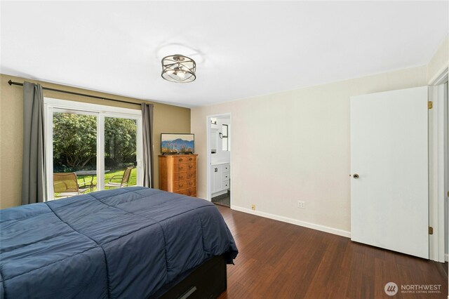 bedroom featuring wood finished floors, access to exterior, baseboards, and ensuite bathroom