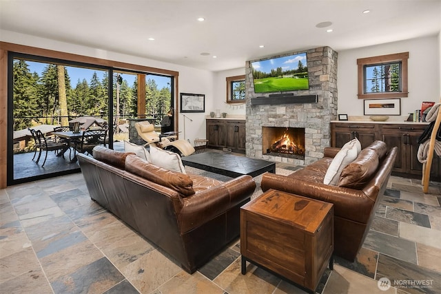 350 Kings Ct, Cle Elum, WA 98922 - living room with stone tile floors, recessed lighting, and a fireplace
