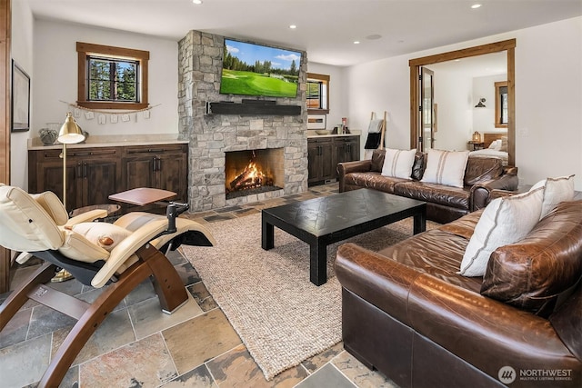 350 Kings Ct, Cle Elum, WA 98922 - living room featuring a fireplace, recessed lighting, and stone tile flooring