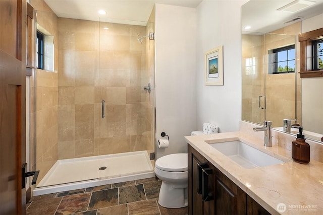 350 Kings Ct, Cle Elum, WA 98922 - bathroom with toilet, a stall shower, stone finish floors, and vanity