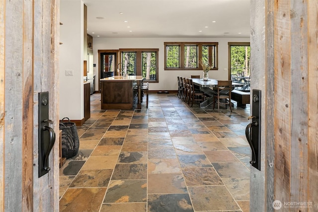 350 Kings Ct, Cle Elum, WA 98922 - dining space with stone tile flooring, baseboards, and recessed lighting