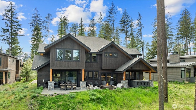 350 Kings Ct, Cle Elum, WA 98922 - back of property with a patio area and a fire pit