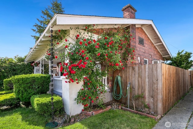 319 1st St, Auburn, WA 98002 - view of side of property with a chimney