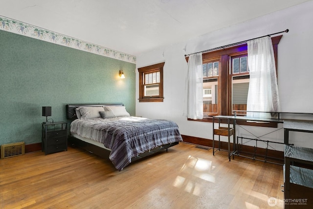 319 1st St, Auburn, WA 98002 - bedroom featuring wood finished floors and baseboards