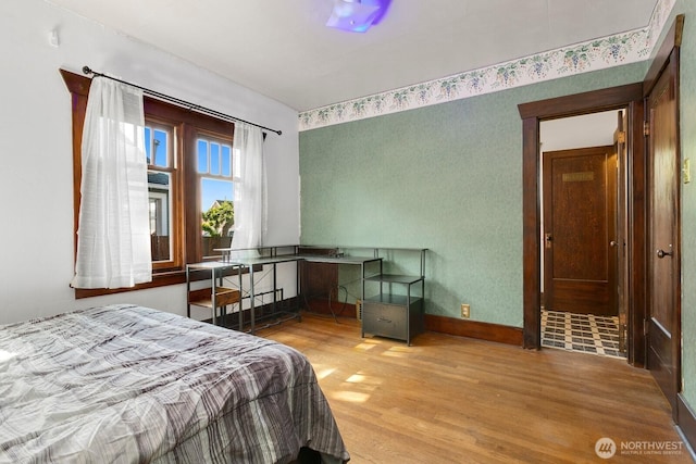 319 1st St, Auburn, WA 98002 - bedroom featuring wood finished floors and baseboards