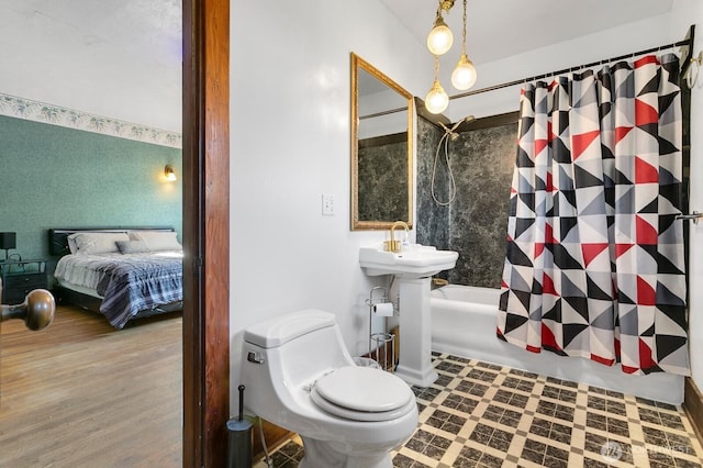 319 1st St, Auburn, WA 98002 - ensuite bathroom with shower / bath combo with shower curtain, toilet, and wood finished floors