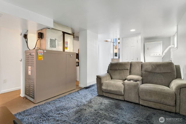 319 1st St, Auburn, WA 98002 - living room with estacked washer and dryer, baseboards, and recessed lighting
