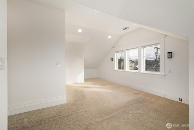 additional living space featuring vaulted ceiling, carpet flooring, recessed lighting, and baseboards