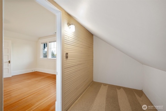 additional living space with vaulted ceiling