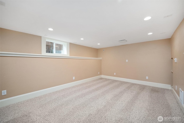 finished below grade area with carpet flooring, recessed lighting, and baseboards