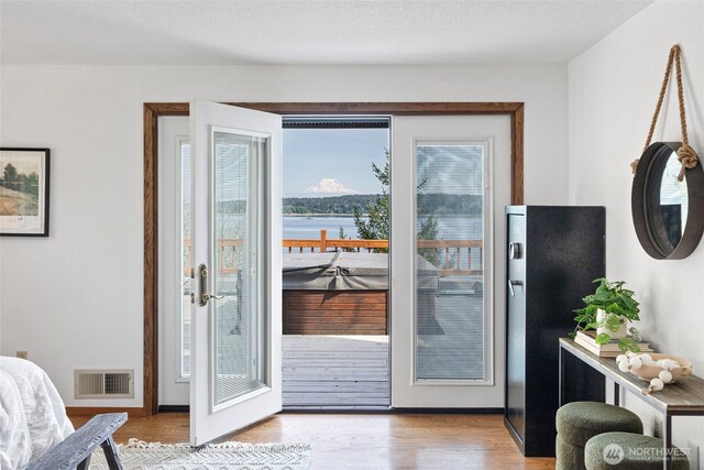 doorway to outside featuring wood finished floors