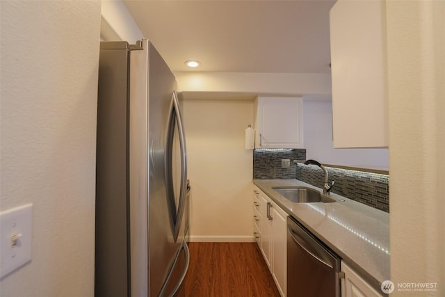 18621 Blueberry Ln Unit B206, Monroe, WA 98272 - kitchen featuring stainless steel appliances, a sink, white cabinetry, dark wood-type flooring, and backsplash