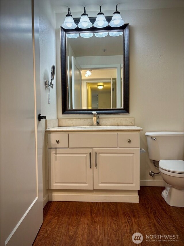 18621 Blueberry Ln Unit B206, Monroe, WA 98272 - bathroom with toilet, wood finished floors, vanity, and baseboards