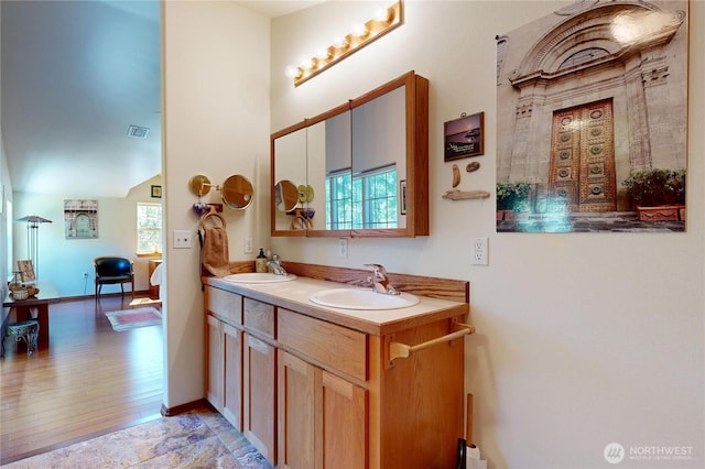 18 Blue Creek Rd, Walla Walla, WA 99362 - bathroom with wood finished floors, double vanity, and baseboards