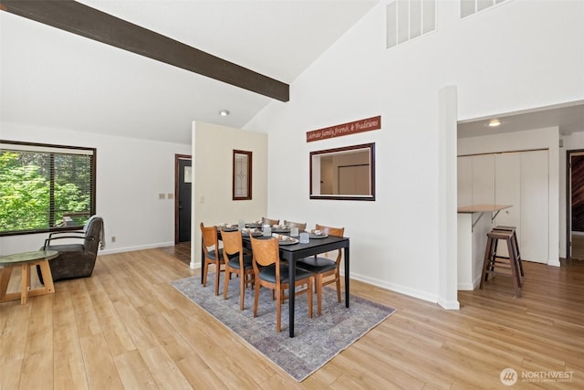 dining space with wood finished floors, recessed lighting, beamed ceiling, high vaulted ceiling, and baseboards