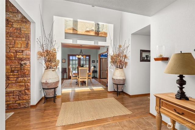 55771 Mossyrock Ave, Mossyrock, WA 98564 - entryway featuring wood finished floors, baseboards, and a chandelier