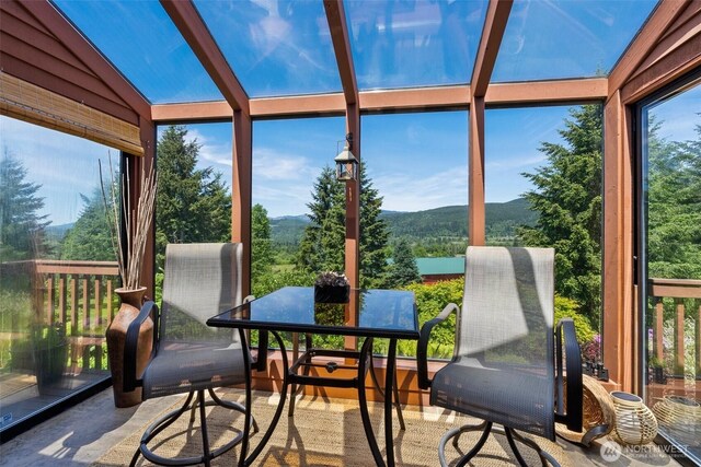 55771 Mossyrock Ave, Mossyrock, WA 98564 - sunroom featuring a mountain view, vaulted ceiling, and a wall of windows