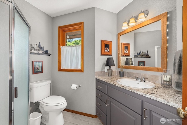 55771 Mossyrock Ave, Mossyrock, WA 98564 - full bathroom with vanity, toilet, baseboards, and a shower with shower door