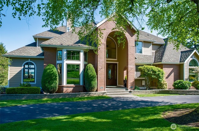 746 Van Dyk Rd, Lynden, WA 98264 - view of front of property featuring brick siding, a front lawn, a chimney, and roof with shingles