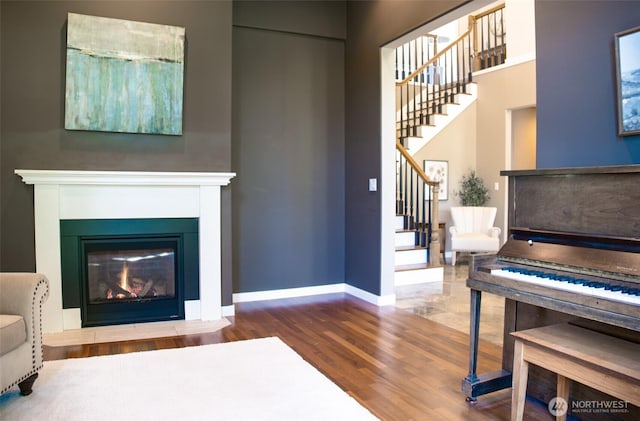746 Van Dyk Rd, Lynden, WA 98264 - living room with stairs, wood finished floors, baseboards, and a fireplace with flush hearth