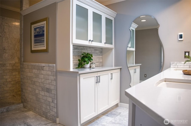746 Van Dyk Rd, Lynden, WA 98264 - interior space with crown molding, light countertops, white cabinets, glass insert cabinets, and arched walkways