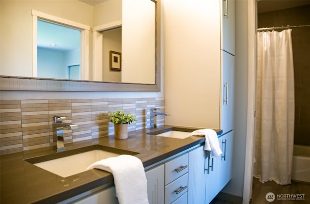 746 Van Dyk Rd, Lynden, WA 98264 - bathroom featuring decorative backsplash, vanity, and shower / bathtub combination with curtain