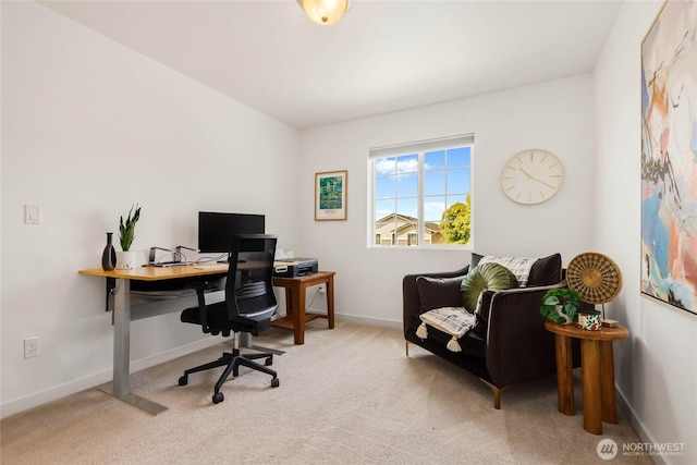 carpeted home office with baseboards