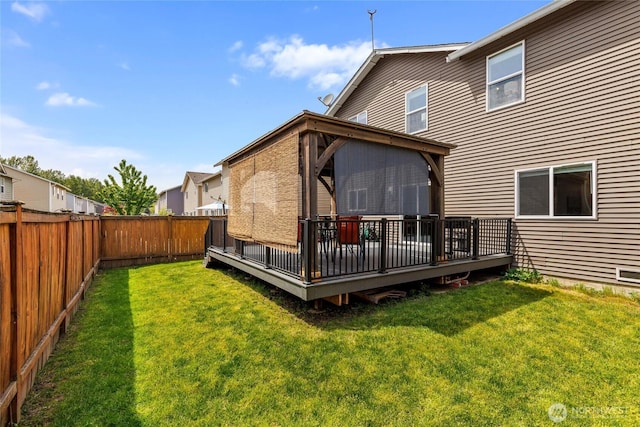 back of house featuring a wooden deck