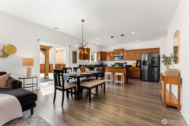 dining room featuring dark wood-type flooring and recessed lighting
