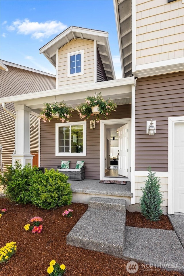 view of exterior entry featuring a porch