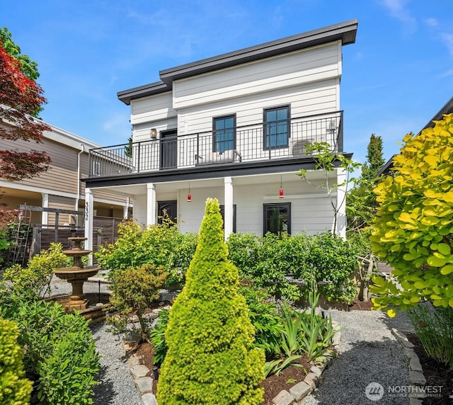 view of front of house with a balcony