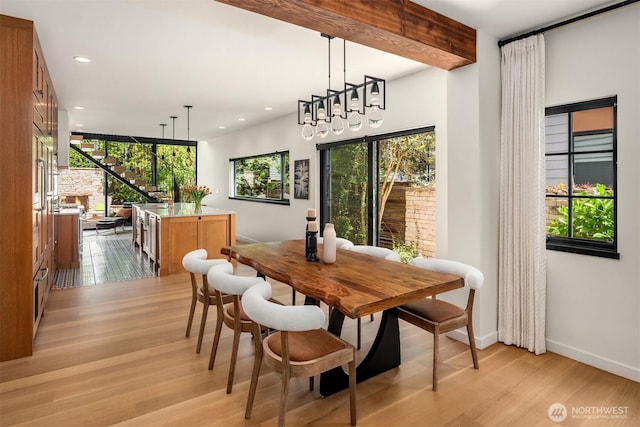 dining area featuring light wood-style floors, recessed lighting, and baseboards