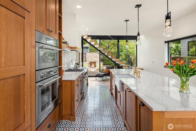 kitchen featuring open shelves, a sink, brown cabinets, and recessed lighting